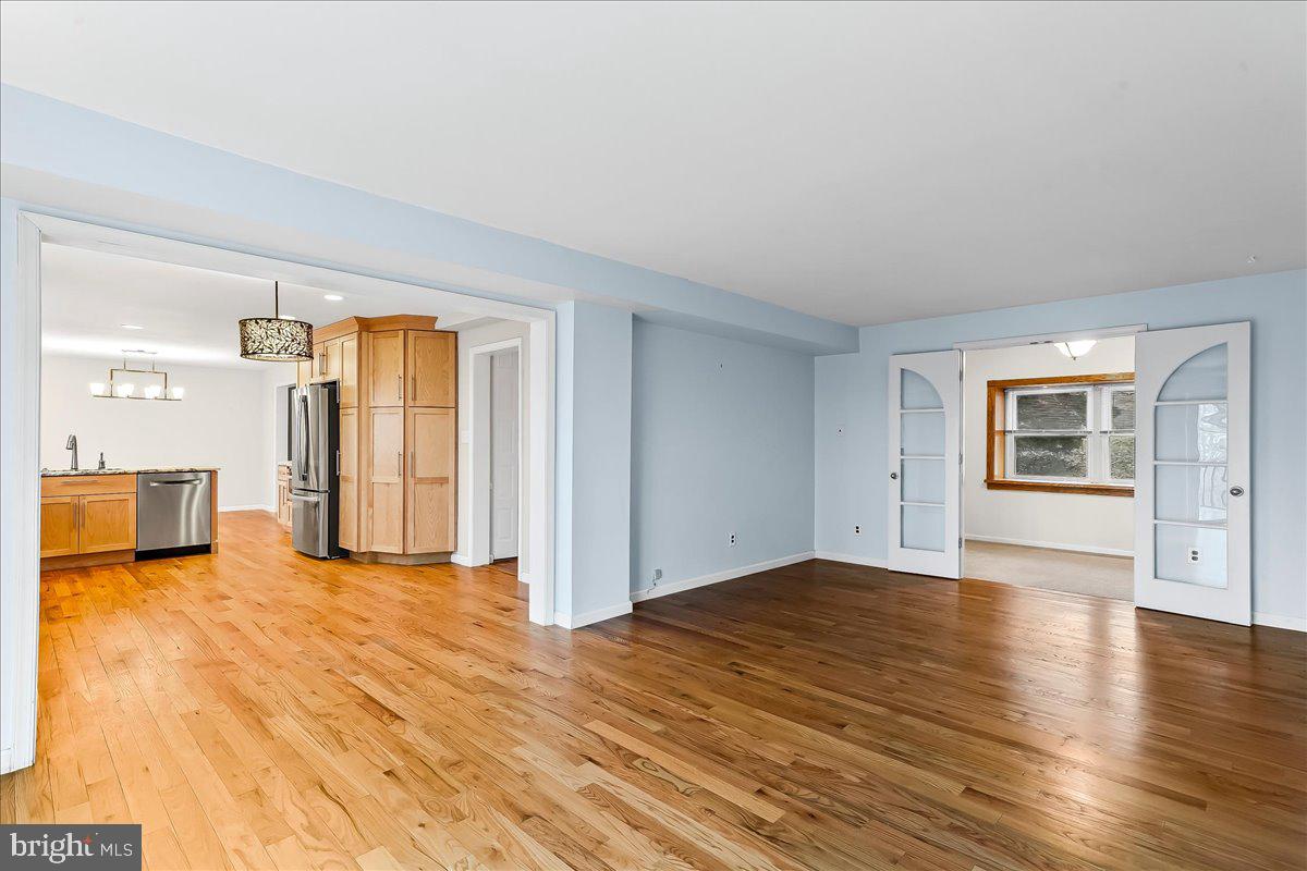 720 Brainerd Road Exton, PA 19341 - Photo 20 of 62 a view of a livingroom with wooden floor and a refrigerator