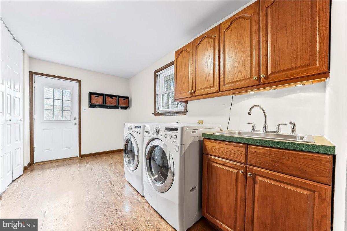 720 Brainerd Road Exton, PA 19341 - Photo 23 of 62 a utility room with sink dryer and washer
