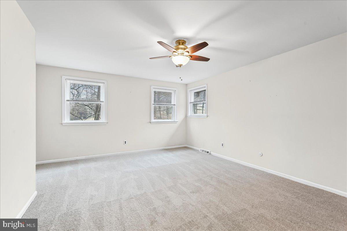 720 Brainerd Road Exton, PA 19341 - Photo 27 of 62 an empty room with windows and fan