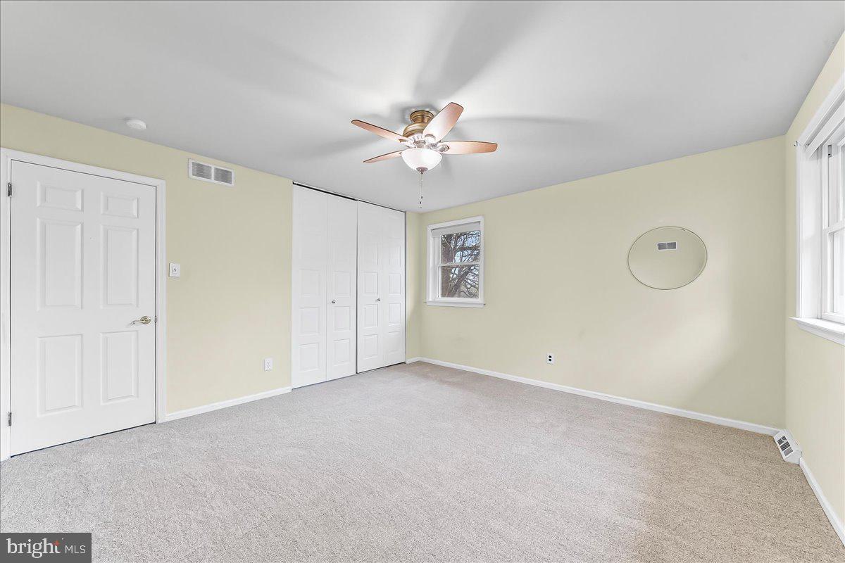 720 Brainerd Road Exton, PA 19341 - Photo 34 of 62 an empty room with windows and fan
