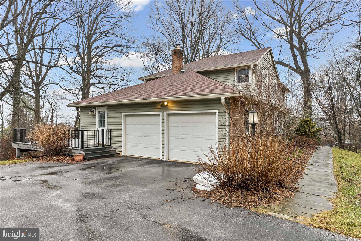 720 Brainerd Road Exton, PA 19341 - Photo 4 of 62 a front view of a house with a yard and garage
