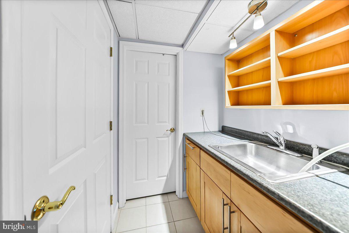 720 Brainerd Road Exton, PA 19341 - Photo 45 of 62 a bathroom with a sink and a mirror