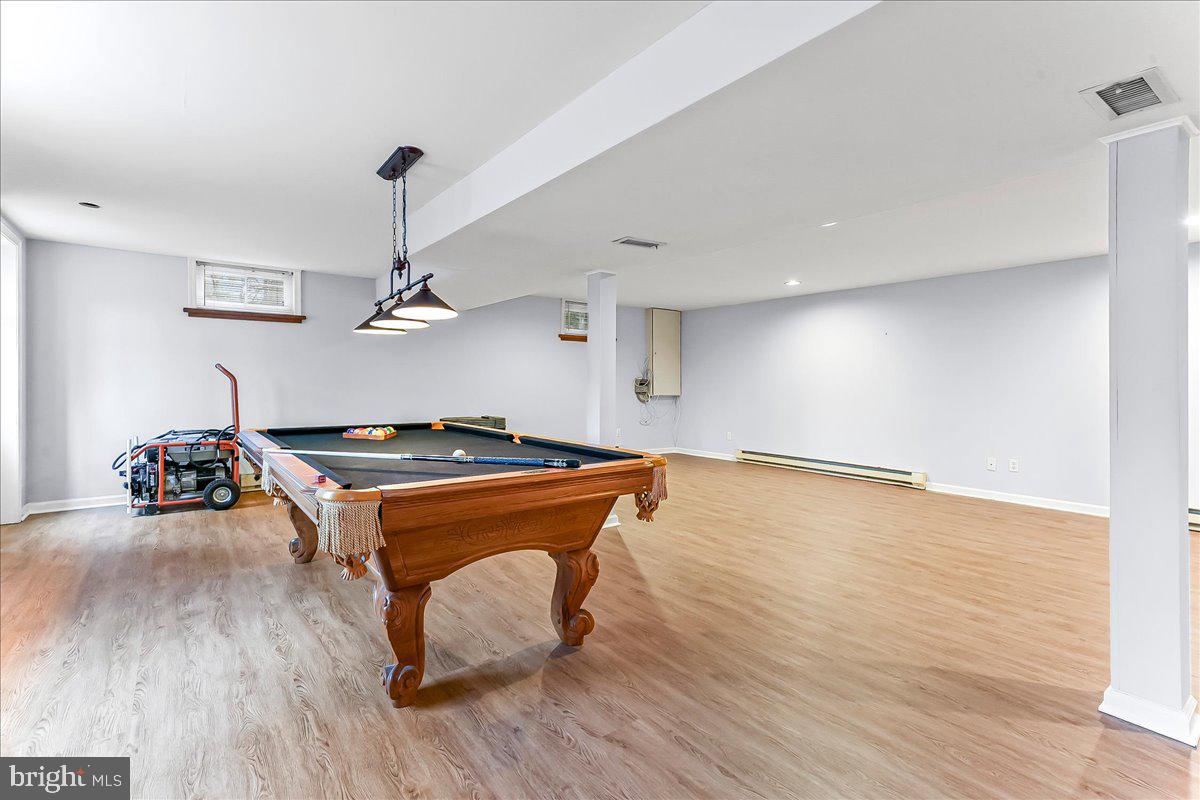 720 Brainerd Road Exton, PA 19341 - Photo 46 of 62 a room with wooden floors and musical instruments
