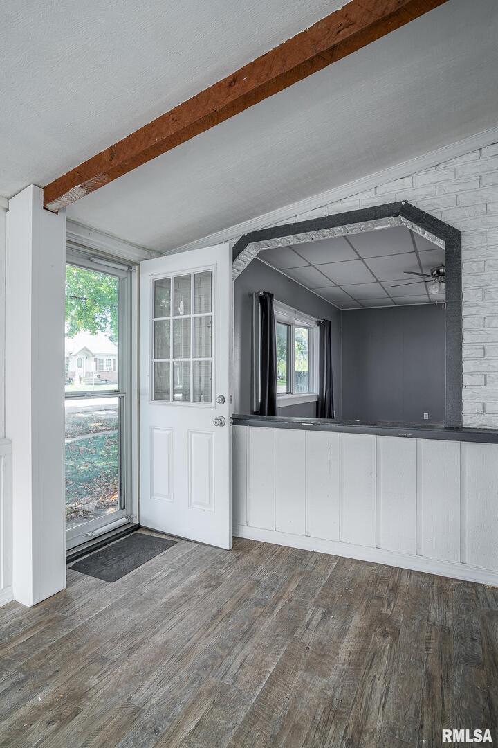 516 North Williams Street Reynolds, IL 61279 - Photo 11 of 17 a view of an empty room with wooden floor and a window