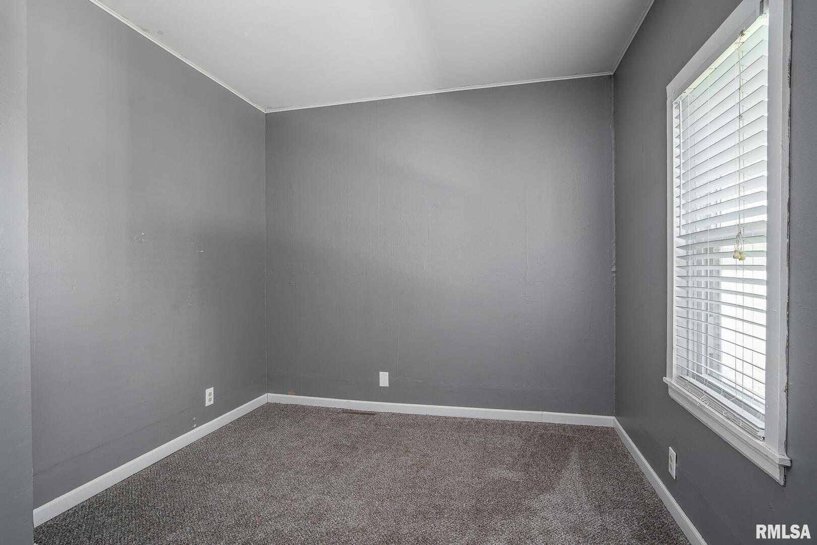516 North Williams Street Reynolds, IL 61279 - Photo 14 of 17 an empty room with a empty space and window