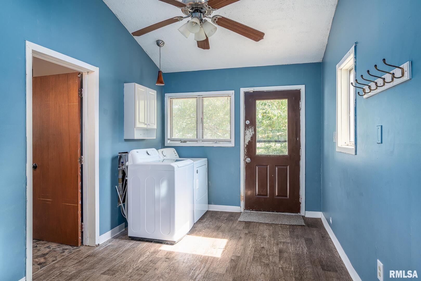 516 North Williams Street Reynolds, IL 61279 - Photo 8 of 17 a view of a hallway with a sink and a window