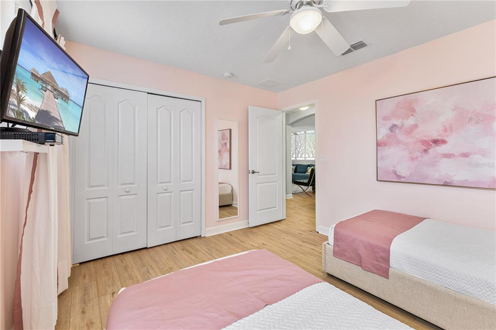 9006 Majesty Palm Road Kissimmee, FL 34747 - Photo 43 of 56 a bedroom with a bed and a flat screen tv