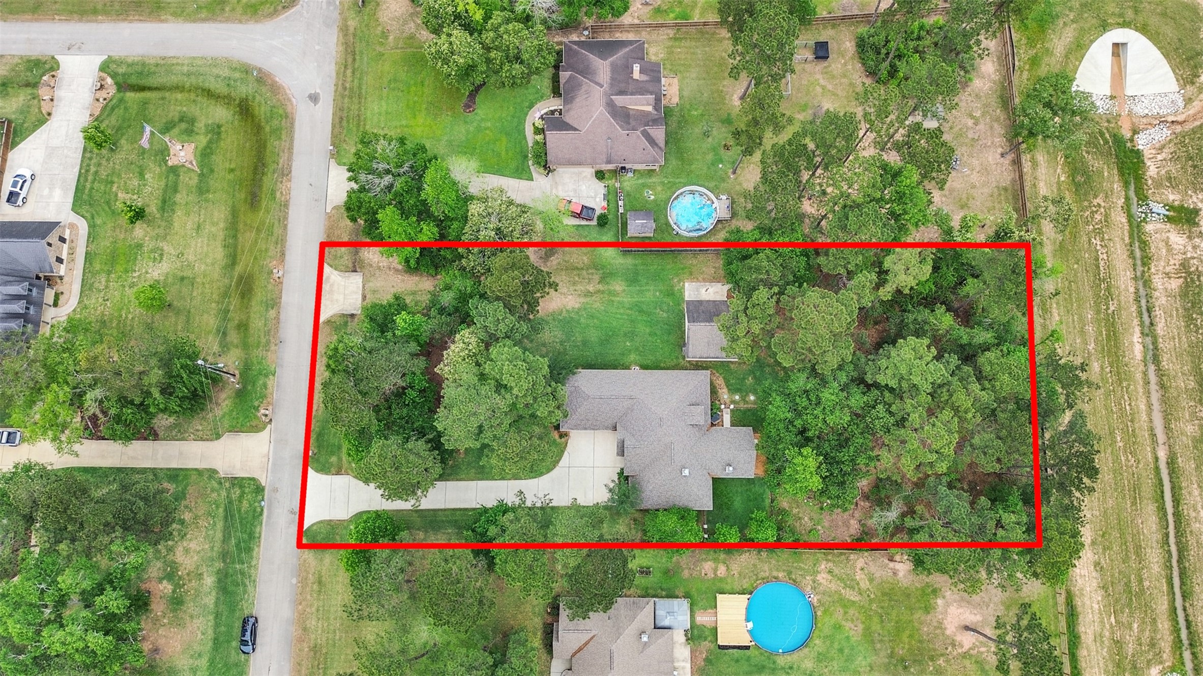 18005 Cindy Lane Conroe, TX 77302 - Photo 6 of 49 The large yard offers ample space and privacy, ideal for outdoor activities. The neighborhood is peaceful and well-maintained.