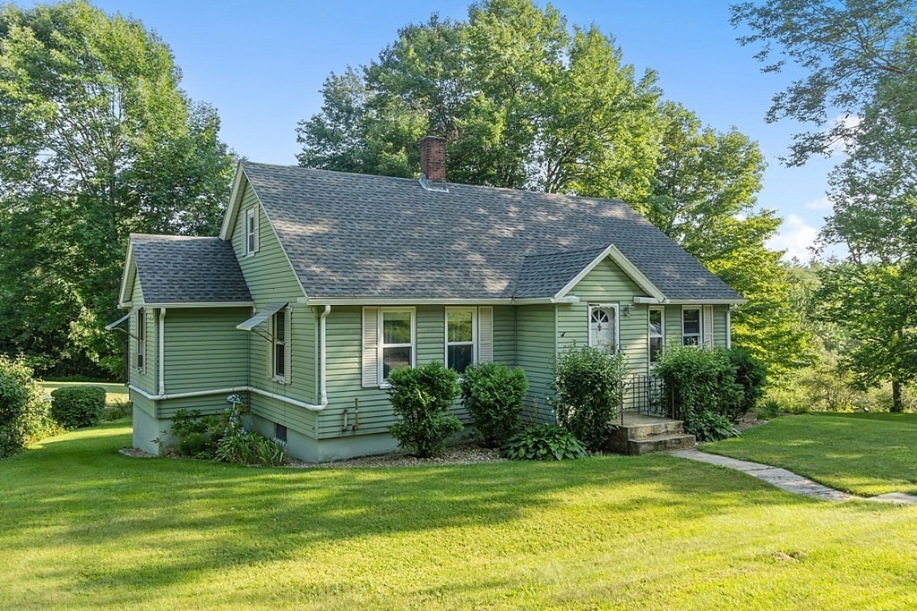 322 Patriots Road Templeton, MA 01468 - Photo 1 of 42 a front view of a house with a garden