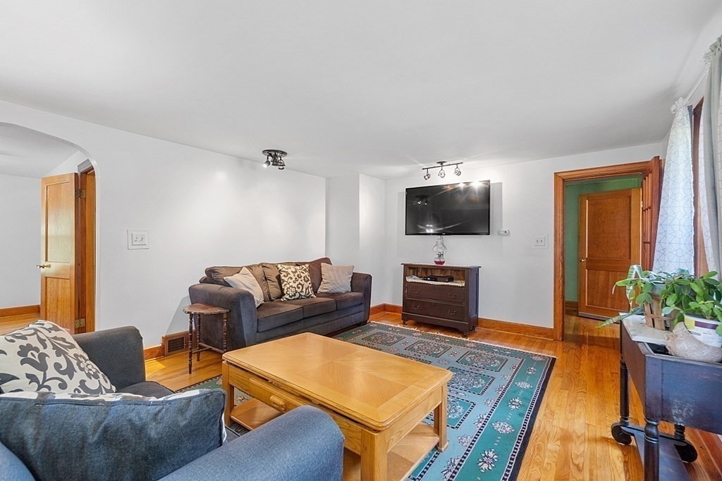 322 Patriots Road Templeton, MA 01468 - Photo 12 of 42 a living room with furniture and a flat screen tv