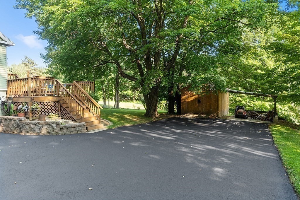 322 Patriots Road Templeton, MA 01468 - Photo 26 of 42 a view of a house with a yard and tree s