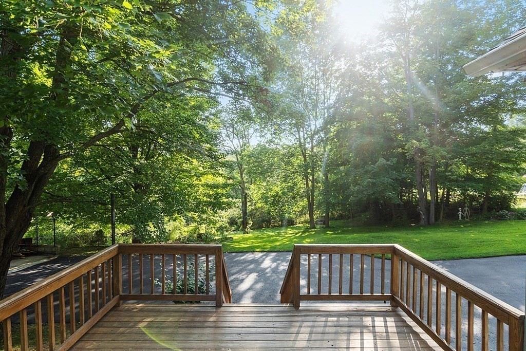 322 Patriots Road Templeton, MA 01468 - Photo 29 of 42 a view of balcony with wooden floor and outdoor seating