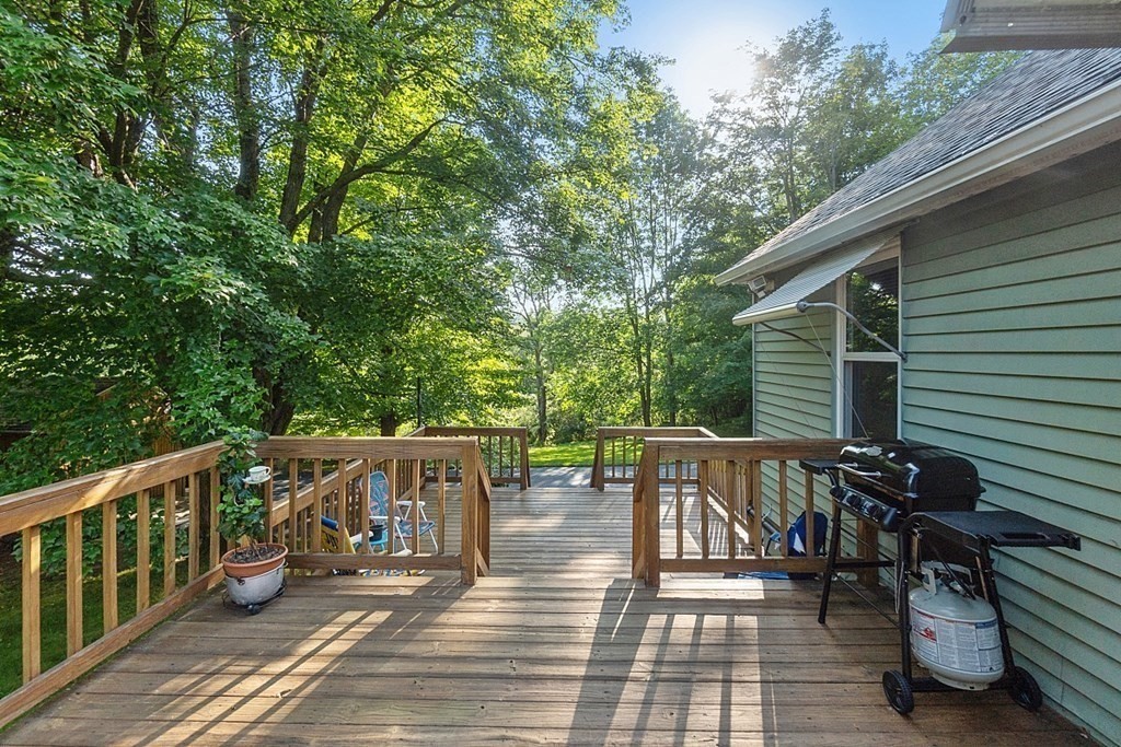 322 Patriots Road Templeton, MA 01468 - Photo 4 of 42 a view of two chairs and table on the deck