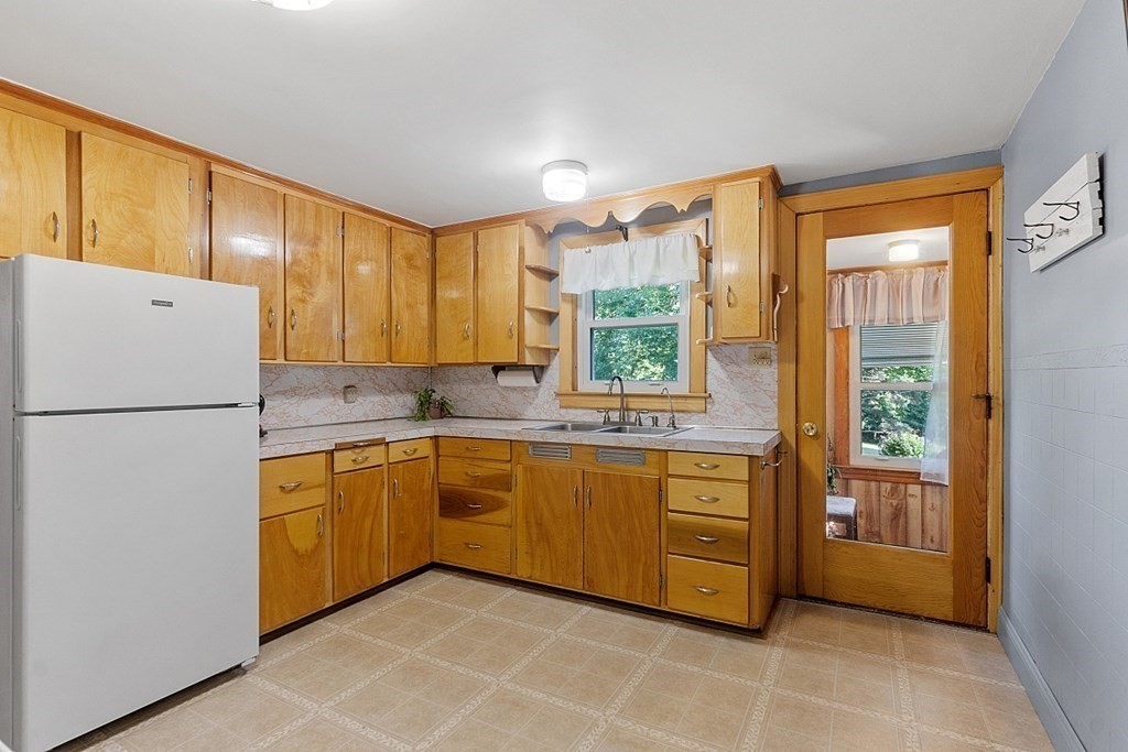 322 Patriots Road Templeton, MA 01468 - Photo 6 of 42 a kitchen with stainless steel appliances granite countertop a refrigerator and a sink