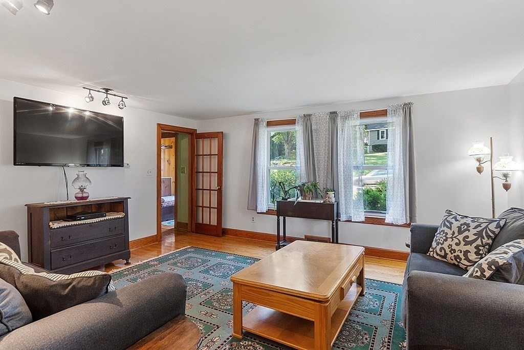 322 Patriots Road Templeton, MA 01468 - Photo 10 of 42 a living room with furniture and a flat screen tv