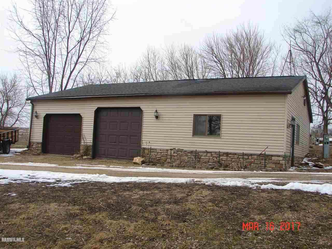 1721 North Union Road Stockton, IL 61085 - Photo 3 of 6 a view of house with snow on the road
