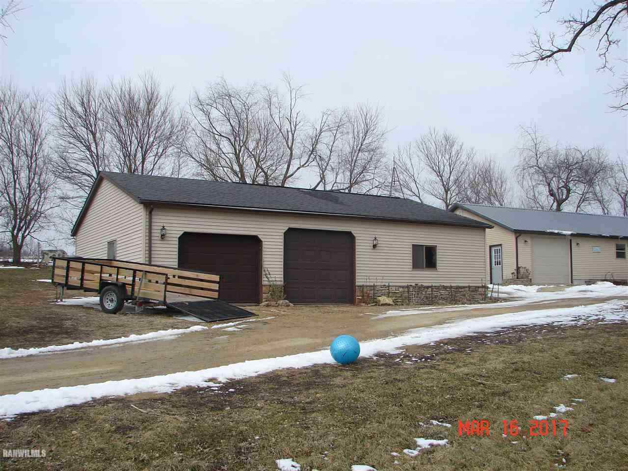 1721 North Union Road Stockton, IL 61085 - Photo 5 of 6 a view of a house with a yard and garage