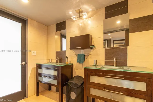 a room with a table chairs and a flat screen tv