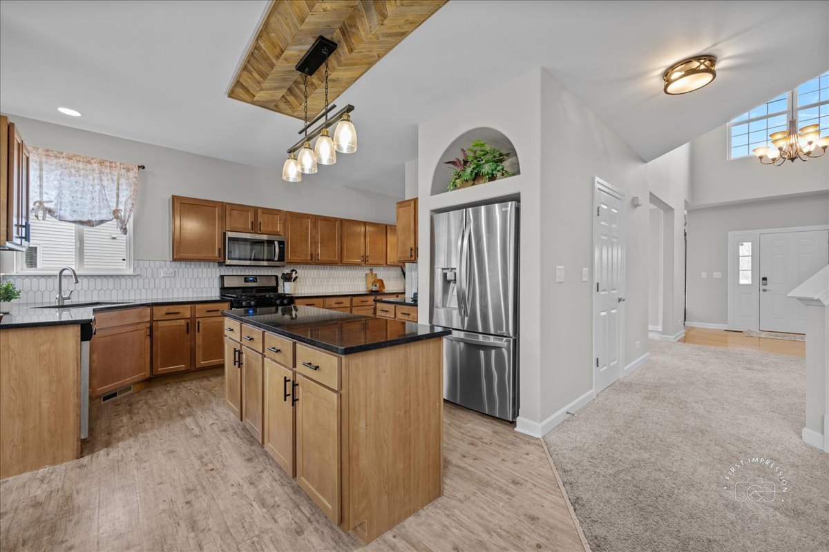 2924 Bauer Road North Aurora, IL 60542 - Photo 11 of 33 a kitchen with stainless steel appliances granite countertop a refrigerator a stove top oven a sink and dishwasher