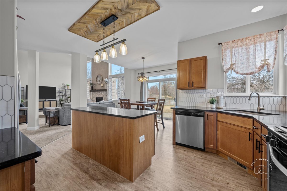 2924 Bauer Road North Aurora, IL 60542 - Photo 13 of 33 a kitchen with stainless steel appliances granite countertop a sink stove and refrigerator