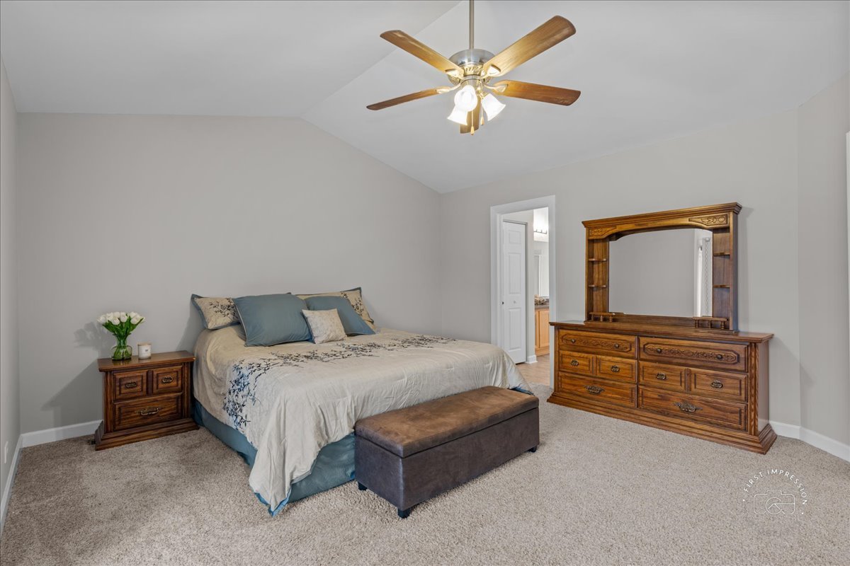 2924 Bauer Road North Aurora, IL 60542 - Photo 19 of 33 a bedroom with a bed and a chandelier