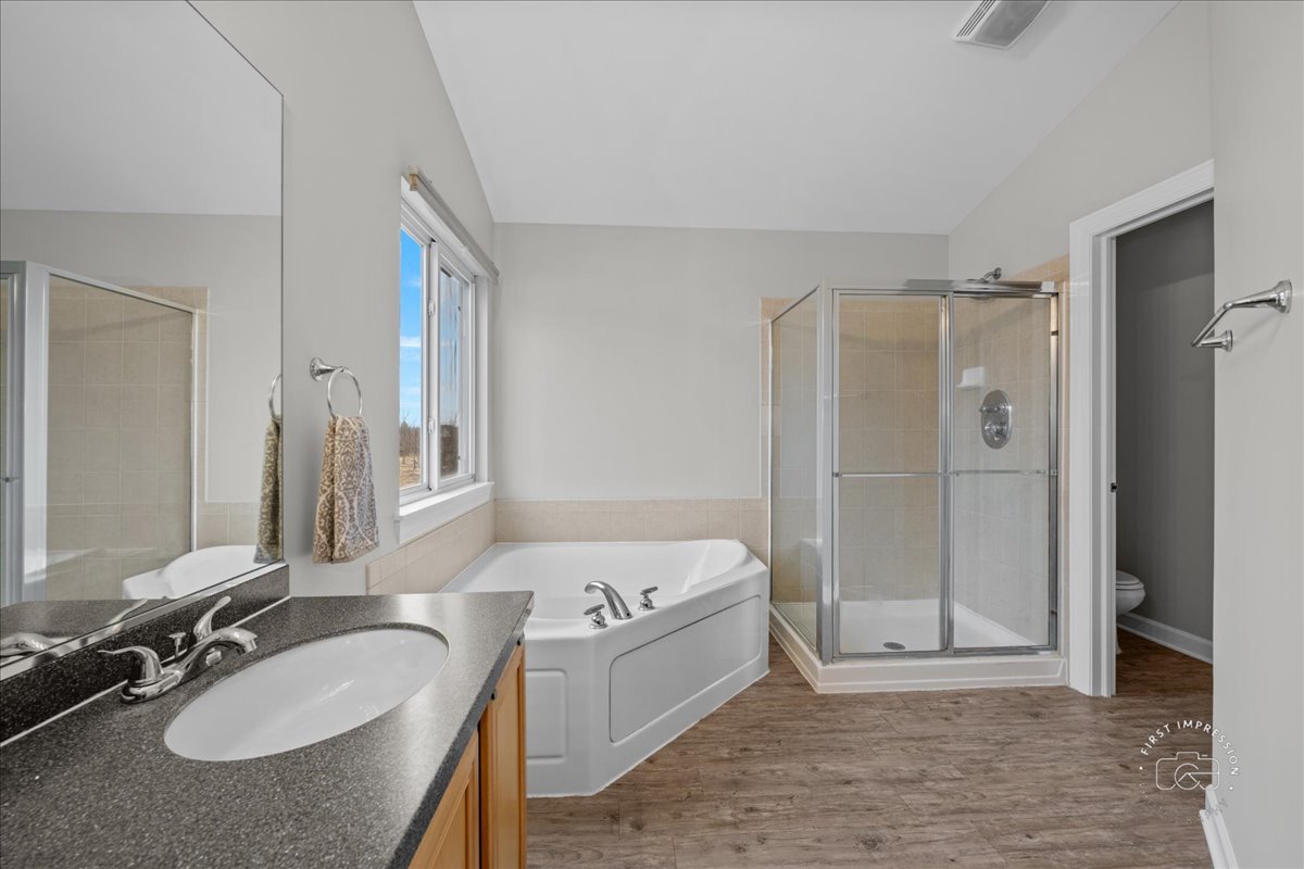 2924 Bauer Road North Aurora, IL 60542 - Photo 21 of 33 a bathroom with a sink double vanity granite tub shower and a mirror