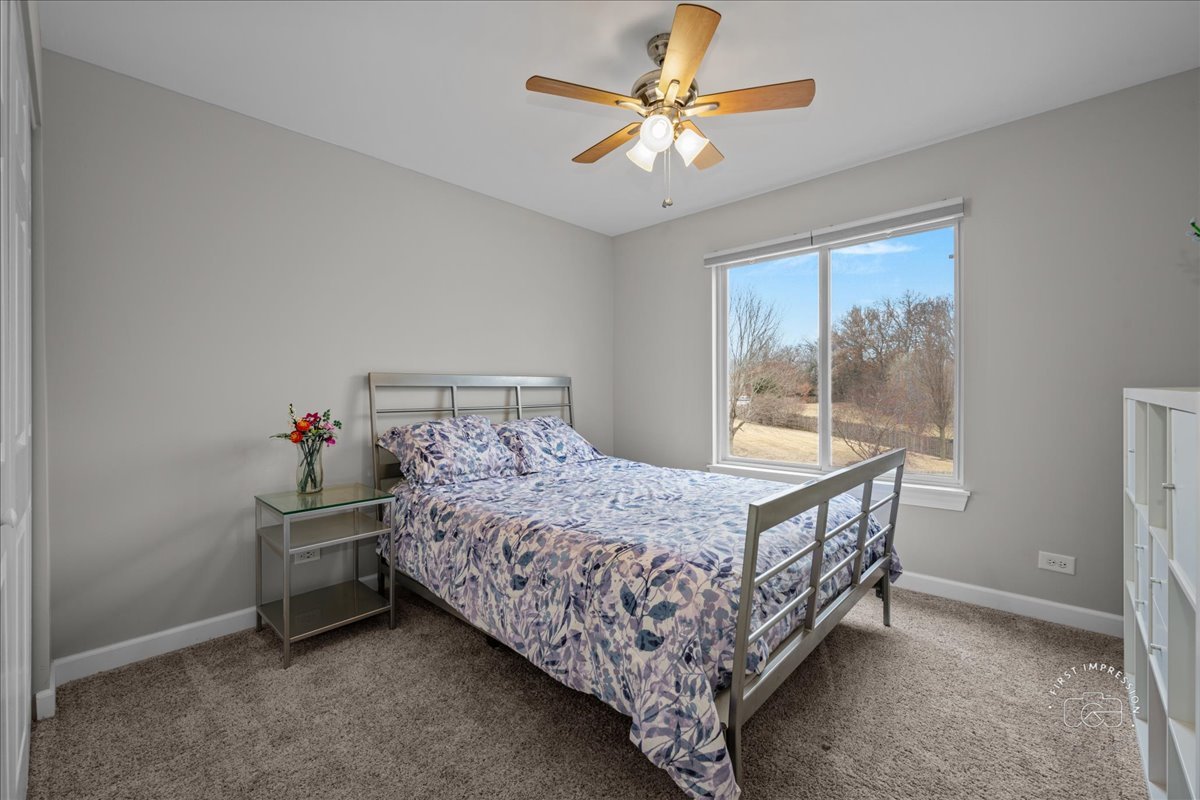 2924 Bauer Road North Aurora, IL 60542 - Photo 24 of 33 a bed sitting in a bedroom next to a window