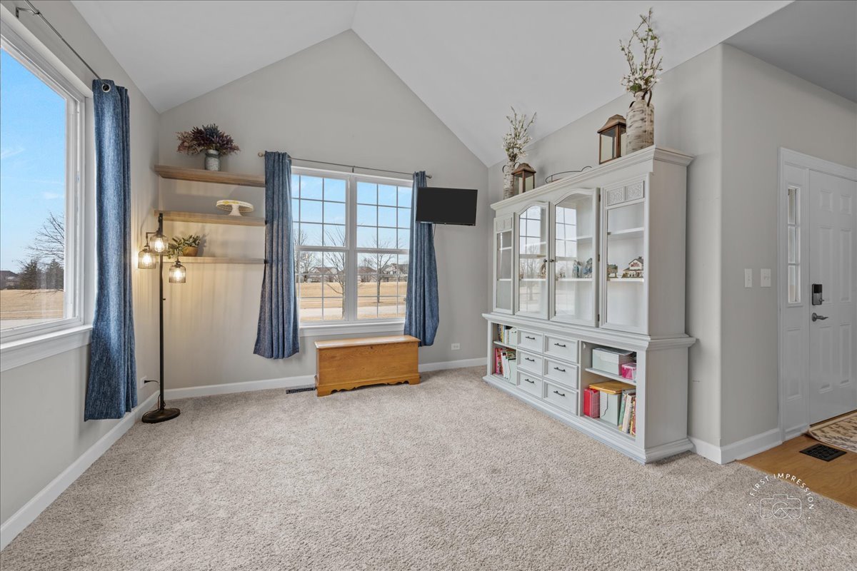 2924 Bauer Road North Aurora, IL 60542 - Photo 7 of 33 a view of an empty room with a fireplace and a window