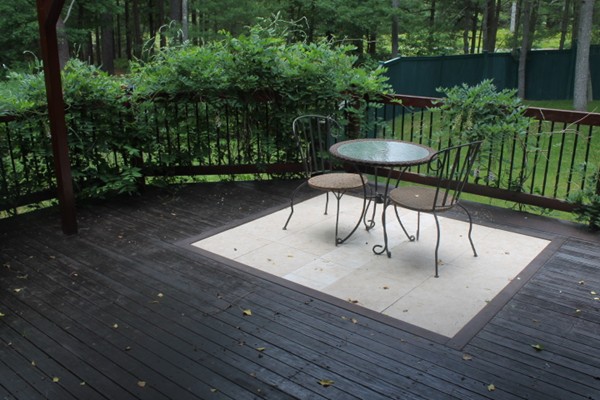103 Wapping Road Kingston, MA 02364 - Photo 16 of 30 a wooden bench sitting in the middle of a backyard