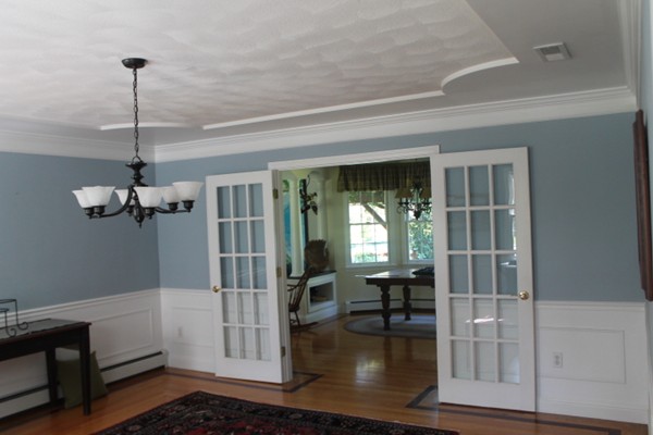 103 Wapping Road Kingston, MA 02364 - Photo 20 of 30 a view of a livingroom with wooden floor staircase and a kitchen