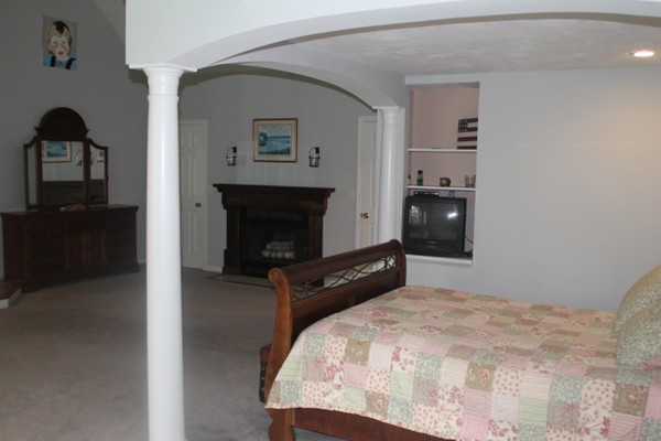 103 Wapping Road Kingston, MA 02364 - Photo 22 of 30 a bedroom with a bed and a television