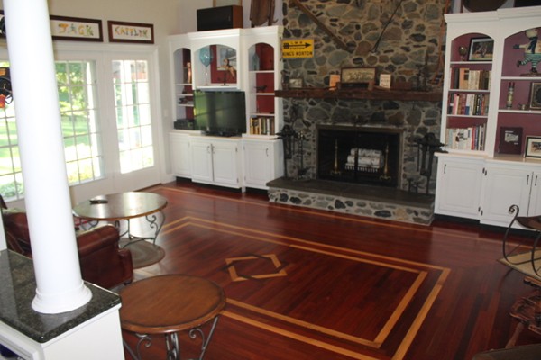 103 Wapping Road Kingston, MA 02364 - Photo 25 of 30 a living room with furniture a flat screen tv and a fireplace