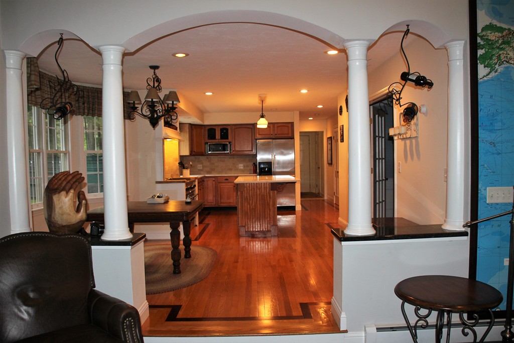 103 Wapping Road Kingston, MA 02364 - Photo 27 of 30 a living room with furniture and a chandelier