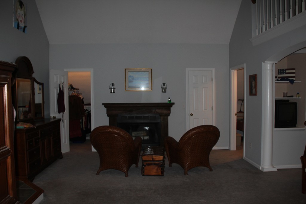 103 Wapping Road Kingston, MA 02364 - Photo 8 of 30 a living room with furniture and a fireplace