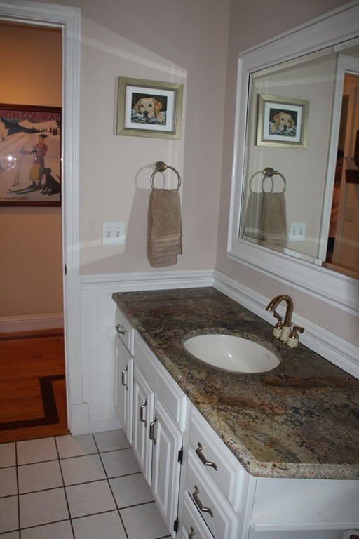 103 Wapping Road Kingston, MA 02364 - Photo 10 of 30 a bathroom with a granite countertop sink and a mirror