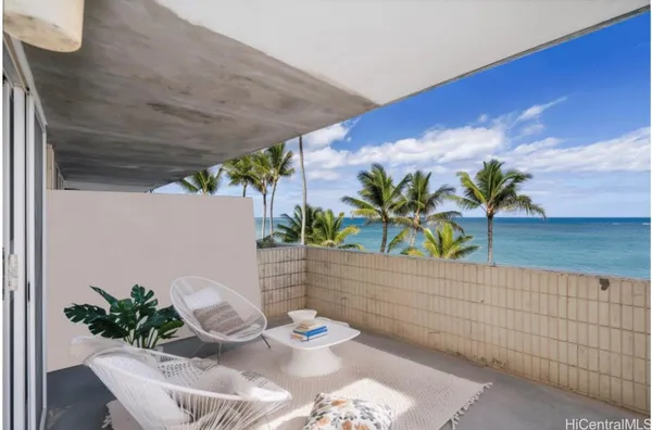 a potted plant sitting on a table and chair