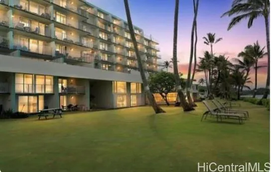 a view of a building with backyard