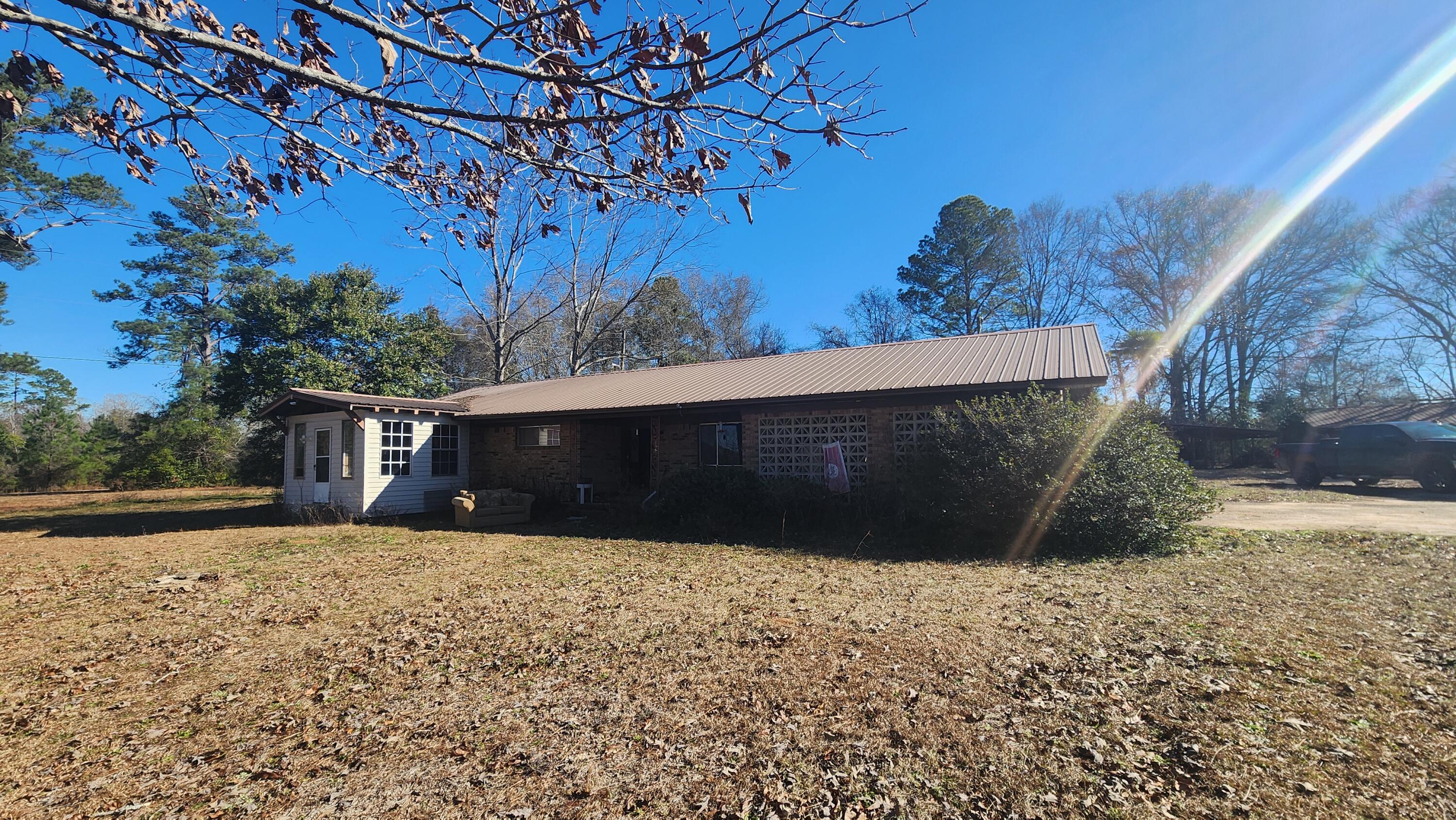 6127 Barnes Road Crestview, FL 32536 - Photo 10 of 16 a front view of a house with a yard