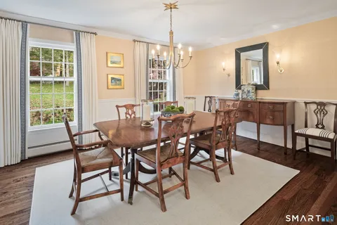 a dining room with furniture window wooden floor
