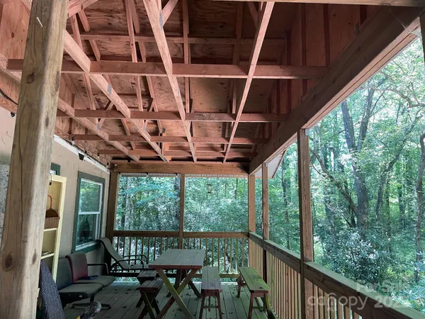 a view of a chairs and table in the balcony