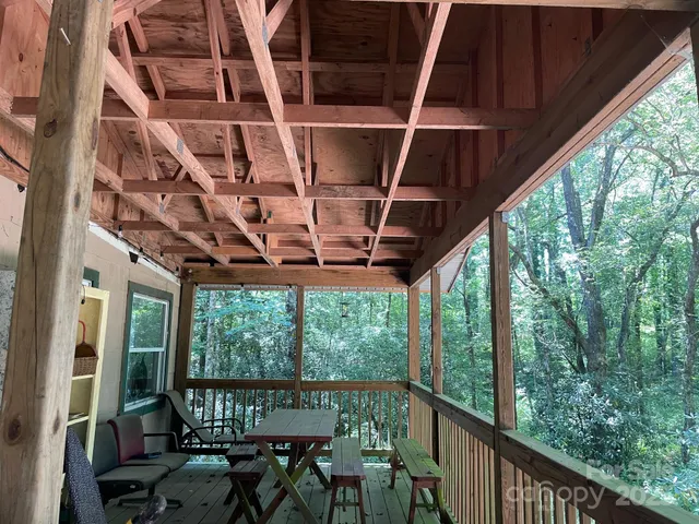 a view of a chairs and table in the balcony