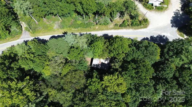 a backyard of a house with a yard and outdoor seating
