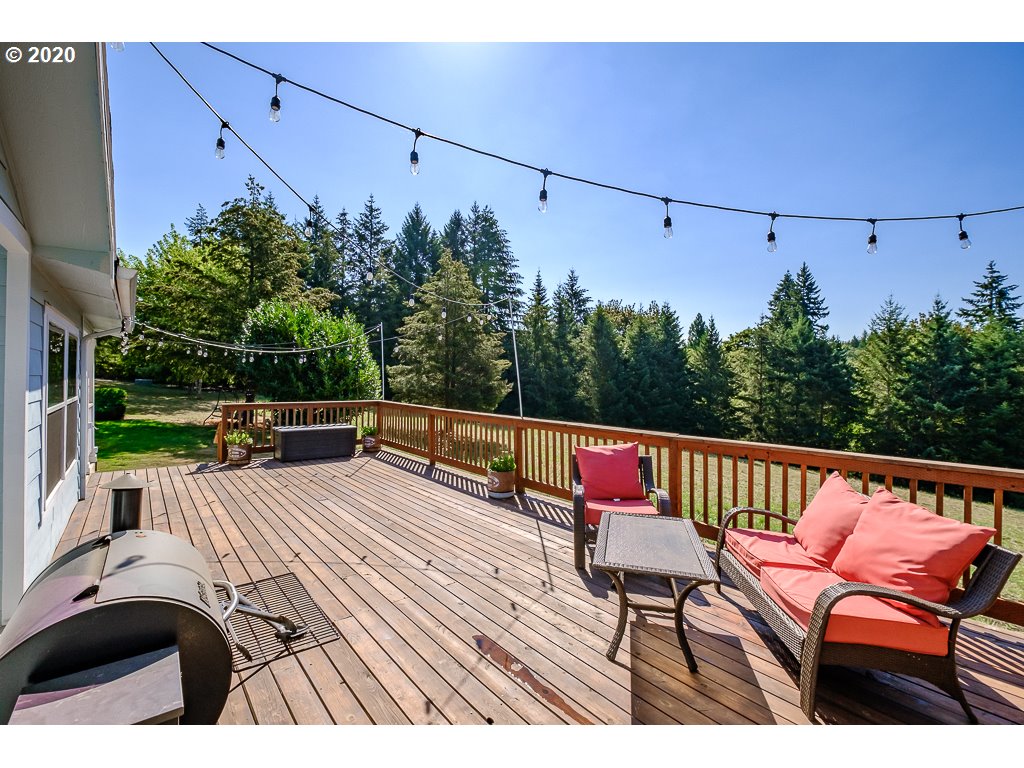 34148 Southeast Jarl Road Boring, OR 97009 - Photo 11 of 32 a view of a chairs and table on the deck
