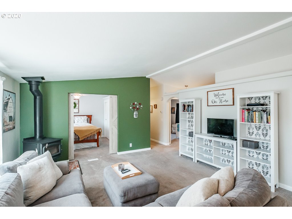 34148 Southeast Jarl Road Boring, OR 97009 - Photo 17 of 32 a living room with furniture and a flat screen tv