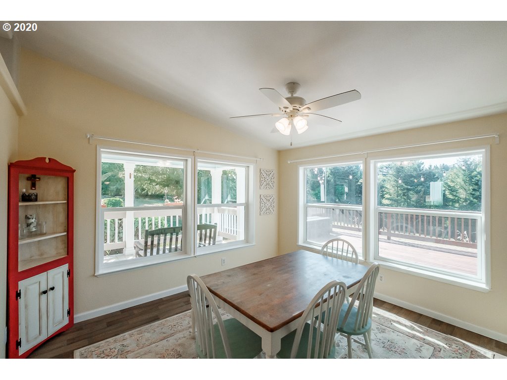 34148 Southeast Jarl Road Boring, OR 97009 - Photo 22 of 32 a view of a dining room with furniture window and wooden floor