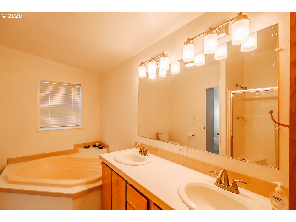 34148 Southeast Jarl Road Boring, OR 97009 - Photo 30 of 32 a bathroom with a sink and a mirror
