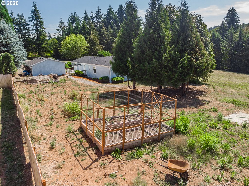 34148 Southeast Jarl Road Boring, OR 97009 - Photo 5 of 32 a view of a backyard with a deck and garden