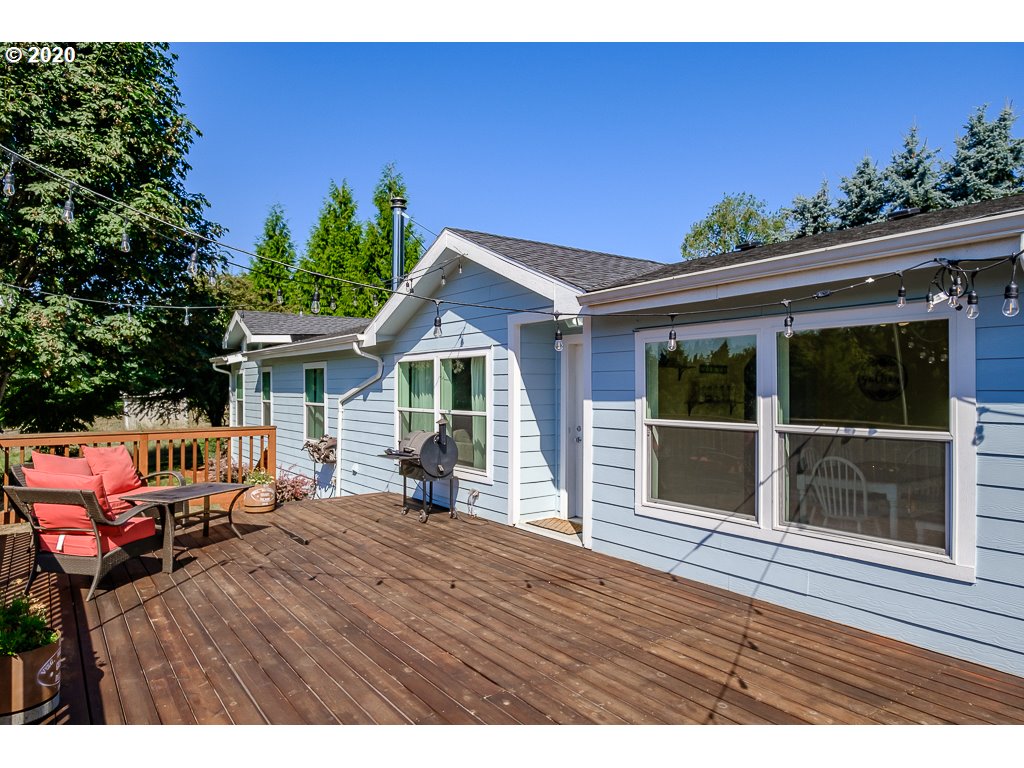 34148 Southeast Jarl Road Boring, OR 97009 - Photo 9 of 32 a view of a house with wooden deck and furniture