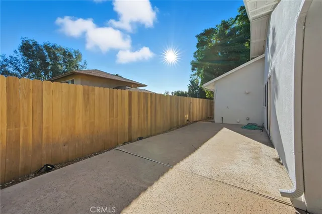 a view of backyard with plants and outdoor seating