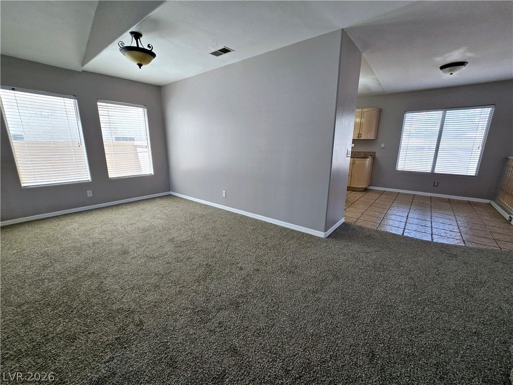 3759 Funston Way Las Vegas, NV 89129 - Photo 24 of 31 A versatile living area with abundant natural light, offering seamless flow into the adjacent kitchen space.